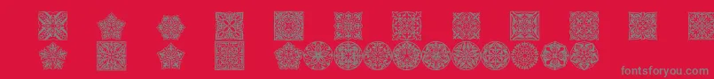 Prtornament5-Schriftart – Graue Schriften auf rotem Hintergrund