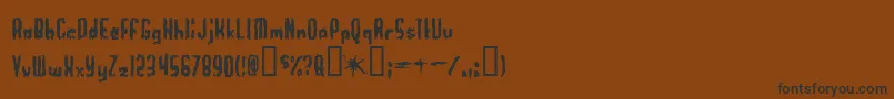 フォントWorthles – 黒い文字が茶色の背景にあります