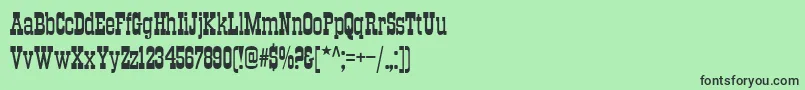 フォントTraktirc – 緑の背景に黒い文字