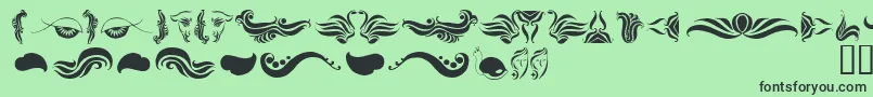 AbsinthFlourishesI Font – Black Fonts on Green Background