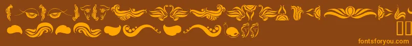 AbsinthFlourishesI Font – Orange Fonts on Brown Background