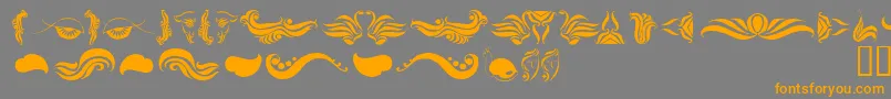AbsinthFlourishesI Font – Orange Fonts on Gray Background