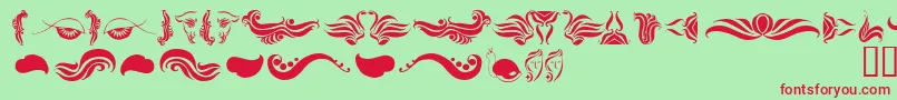 AbsinthFlourishesI Font – Red Fonts on Green Background