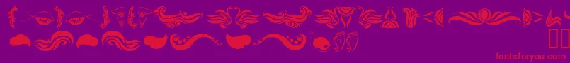 AbsinthFlourishesI Font – Red Fonts on Purple Background