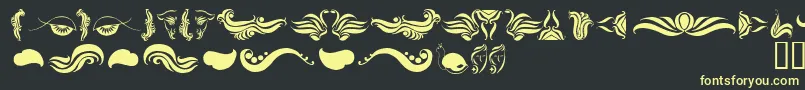 AbsinthFlourishesI-fontti – keltaiset fontit mustalla taustalla