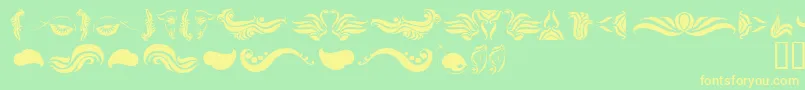 AbsinthFlourishesI Font – Yellow Fonts on Green Background