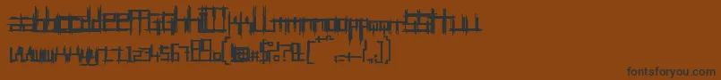 Czcionka BruisedTwentyfive – czarne czcionki na brązowym tle
