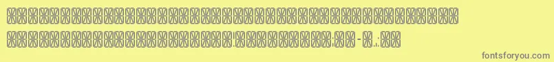 フォントTransponderGridAoe – 黄色の背景に灰色の文字