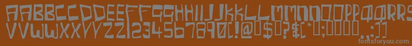 Cherc-fontti – harmaat kirjasimet ruskealla taustalla