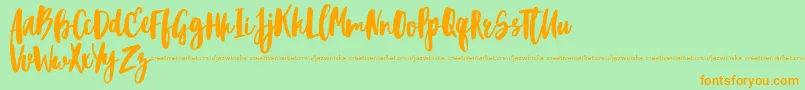 BlacktearDemo Font – Orange Fonts on Green Background