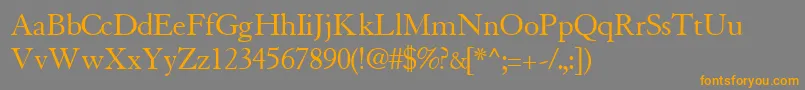 フォントTiascosskRegular – オレンジの文字は灰色の背景にあります。