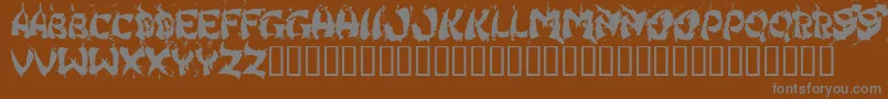 フォントHongkff – 茶色の背景に灰色の文字