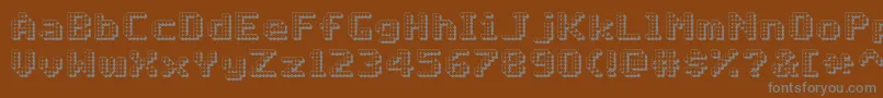 フォントMatrixComplex3DNc – 茶色の背景に灰色の文字