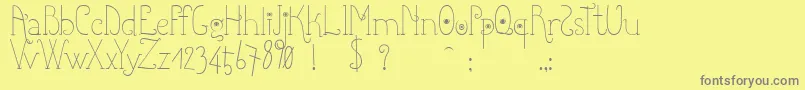 Shicoo-Schriftart – Graue Schriften auf gelbem Hintergrund