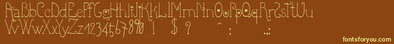 Shicoo-fontti – keltaiset fontit ruskealla taustalla