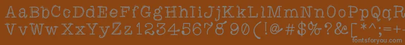 Caretodance Font – Gray Fonts on Brown Background