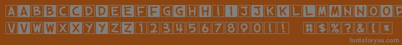 CubeVol2-Schriftart – Graue Schriften auf braunem Hintergrund