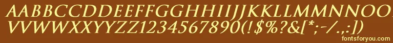 TrajanNormalBoldItalic-fontti – keltaiset fontit ruskealla taustalla