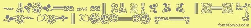 フォントAuriolFlowers – 黄色の背景に灰色の文字