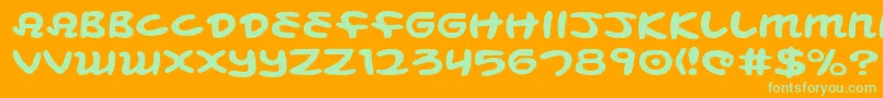 Mbeanse-Schriftart – Grüne Schriften auf orangefarbenem Hintergrund