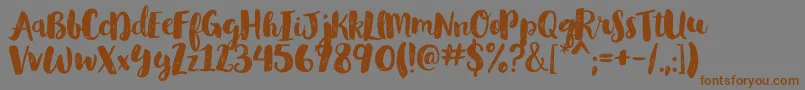 GlamourbrushRegular-Schriftart – Braune Schriften auf grauem Hintergrund
