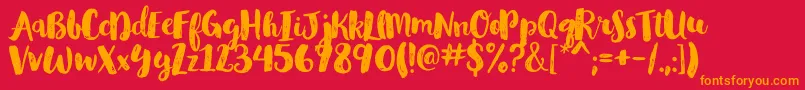 フォントGlamourbrushRegular – 赤い背景にオレンジの文字