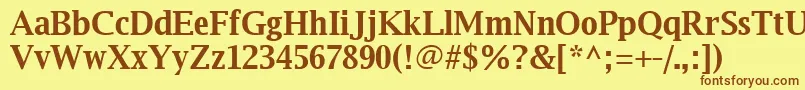 フォントLuxirb – 茶色の文字が黄色の背景にあります。