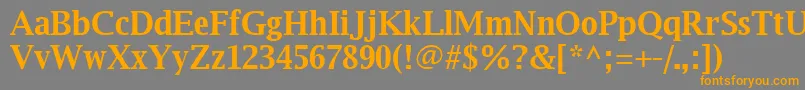 フォントLuxirb – オレンジの文字は灰色の背景にあります。