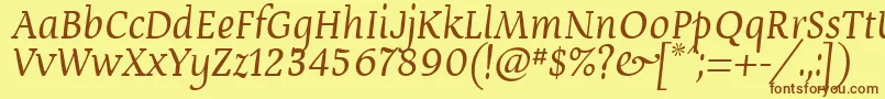 フォントDevroyun – 茶色の文字が黄色の背景にあります。