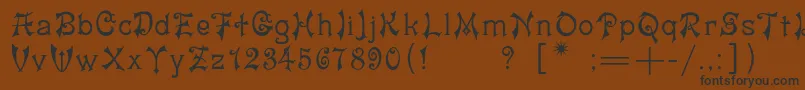 フォントYashmac – 黒い文字が茶色の背景にあります