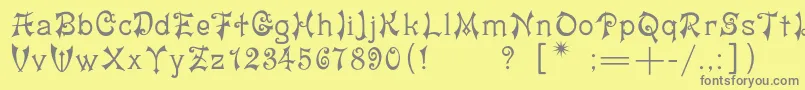 フォントYashmac – 黄色の背景に灰色の文字