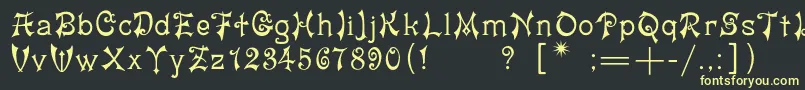 フォントYashmac – 黒い背景に黄色の文字