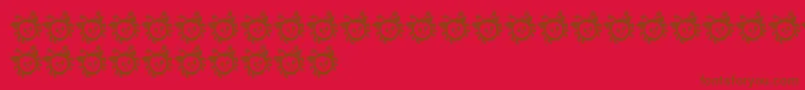 CuddlebugsBug-Schriftart – Braune Schriften auf rotem Hintergrund