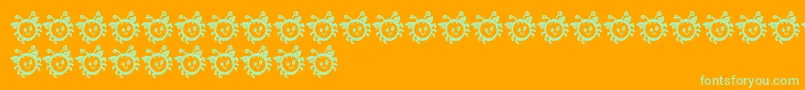 CuddlebugsBug-Schriftart – Grüne Schriften auf orangefarbenem Hintergrund