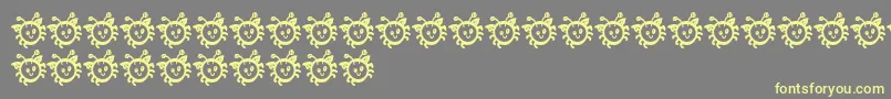 CuddlebugsBug Font – Yellow Fonts on Gray Background