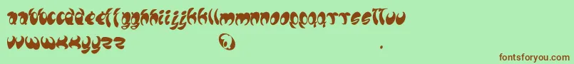 フォントLomax – 緑の背景に茶色のフォント