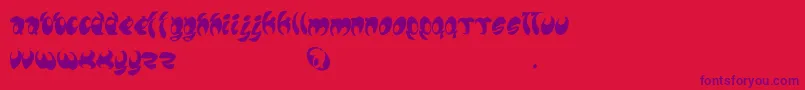 フォントLomax – 赤い背景に紫のフォント