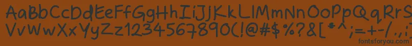 フォントZakirahshandb – 黒い文字が茶色の背景にあります