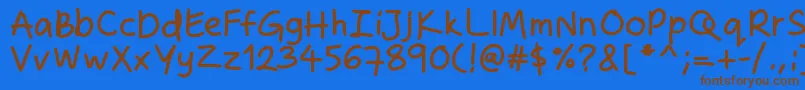 フォントZakirahshandb – 茶色の文字が青い背景にあります。