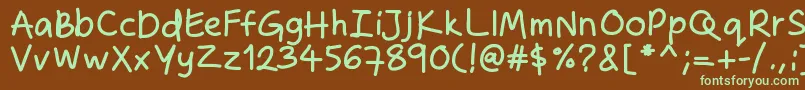 フォントZakirahshandb – 緑色の文字が茶色の背景にあります。