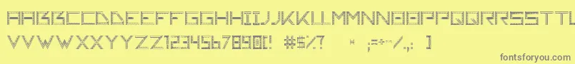 フォントTsachi – 黄色の背景に灰色の文字