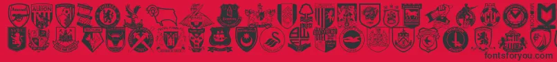 Englishfootballclubbadges-Schriftart – Schwarze Schriften auf rotem Hintergrund