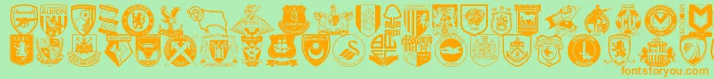 フォントEnglishfootballclubbadges – オレンジの文字が緑の背景にあります。