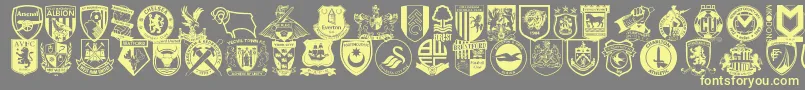 Englishfootballclubbadges-Schriftart – Gelbe Schriften auf grauem Hintergrund