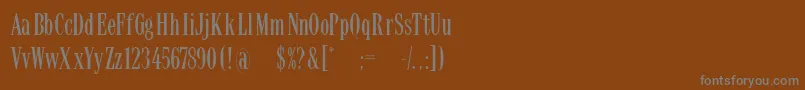 Latinsmall-fontti – harmaat kirjasimet ruskealla taustalla