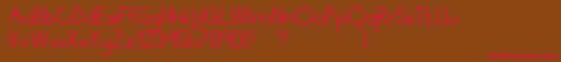 フォントHumanp.JAverage – 赤い文字が茶色の背景にあります。