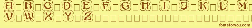 AdageDisplayCapsSsi-fontti – ruskeat fontit keltaisella taustalla