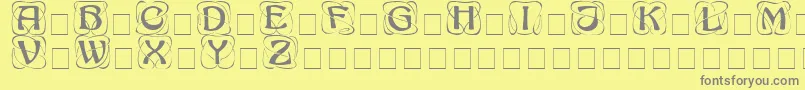 AdageDisplayCapsSsi Font – Gray Fonts on Yellow Background