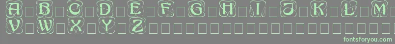 Шрифт AdageDisplayCapsSsi – зелёные шрифты на сером фоне