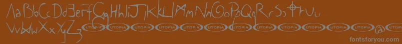 TheCowboyFont-Schriftart – Graue Schriften auf braunem Hintergrund